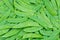 Green snow pea pods background