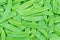 Green snow pea pods background
