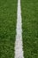 Green soccer field turf with white painted line