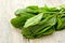 Green sorrel on a wooden background.