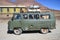 Green Soviet old van loaded with bicycle in Pamir mountains