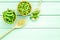 Green soybeans or edamame in spoon and bowl for fresh healthy food on mint green background top view space for text