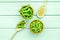 Green soybeans or edamame in spoon and bowl for fresh healthy food on mint green wooden background top view