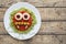 Green spaghetti pasta creative spooky halloween vegetarian food vampire monster with smile