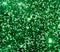 Green sparkle glitter background. Glittering sequins wall.