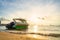 Green speedboat is in the sea in beautiful sunset at Pattaya, Thailand