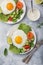 Green spinach crepes with fried eggs, smoked salmon and vegetables for breakfast
