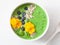 Green spinach smoothie bowl with blueberry, chia seed and edible