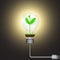 Green sprout with globe in shining light bulb connected to electrical plug, alternative green energy environmental concept