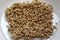 Green sprouts buckwheat on a white plate , nutrition