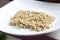 Green sprouts buckwheat on a white plate , nutrition