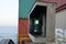 Green starboard side navigational lights of the loaded container ship.