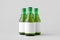 Green steinie beer bottle mockup with blank label