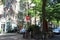 Green street and houses in Amsterdam. Road sign Brick and bicycle.