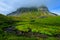 Green summer landscape, rock hill in the clouds, Svalbard, Norway