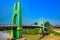 Green suspension bridge across Nan River at Chum Saeng District