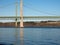 Green suspension bridge under blue sky in summer