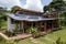 green and sustainable house, with solar panels and rainwater harvesting system visible