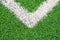 Green synthetic grass sports field with white line