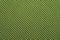 Green synthetic material. fabric texture close up. woven background. braided surface. stitches of fibers