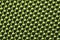 Green synthetic material. fabric texture close up. woven background. braided surface. stitches of fibers