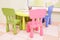 Green table and colorful chairs for little kids