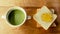 Green tea with breads slice with orange jam