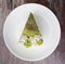 Green tea cake on a simple white plate