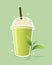 Green tea frappe with whipped cream in take a way cup and green tea leaf.