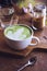 Green tea hot drink latte white cup on wood table aroma relax ti