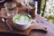 Green tea hot drink latte white cup on wood table aroma relax ti