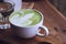 Green tea hot drink latte white cup on wood table aroma relax ti