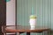 Green tea iced matcha latte on wooden table with copyspace in coffee shop, Iced green matcha tea mixed with ice and milk