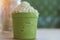 Green tea matcha latte smoothies in coffee cafe