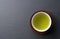 Green tea placed on a black background with space. Image of Japanese green tea