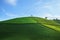 Green tea plantation hills with blue sky on background