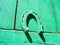 Green and teal wooden plank background with horseshoe concept talisman. Wooden texture turquoise board, door of home