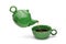 Green teapot pouring tea into a green cup