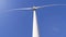 Green technology energy, blades of windmill spin in air against heaven