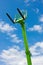 Green Telescopic Hydraulic Forks with blue sky