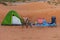 A green tent for family camping in the sand dunes of the United Arab Emirates desert. Family fun, , quiet, arid