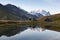 Green tent in the mountains during a colorful sunset. Night bivouac, million star hotel under night sky, tent on pass in Alps.