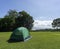 Green tent Spread on the grass at the tent-spreading spot of Huai Mae Khamin Waterfall, Kanchanaburi, Thailand