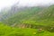 Green terraced fields and traditional architecture in the ancient Tibetan Nar village