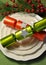 Green theme Christmas dining table setting with fine china plates and Christmas Bon Bon Crackers