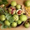 Green and thorny horse chestnut fruits in interior, top view.