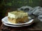 Green three milk cake with japanese tea matcha on wooden background. Traditional dessert of Latin America Tres leches.