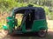 A green three-wheeler. In Sri Lanka.