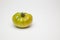 Green tomato on plain background, healthy food