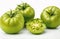 Green tomatoes, cut out on white background